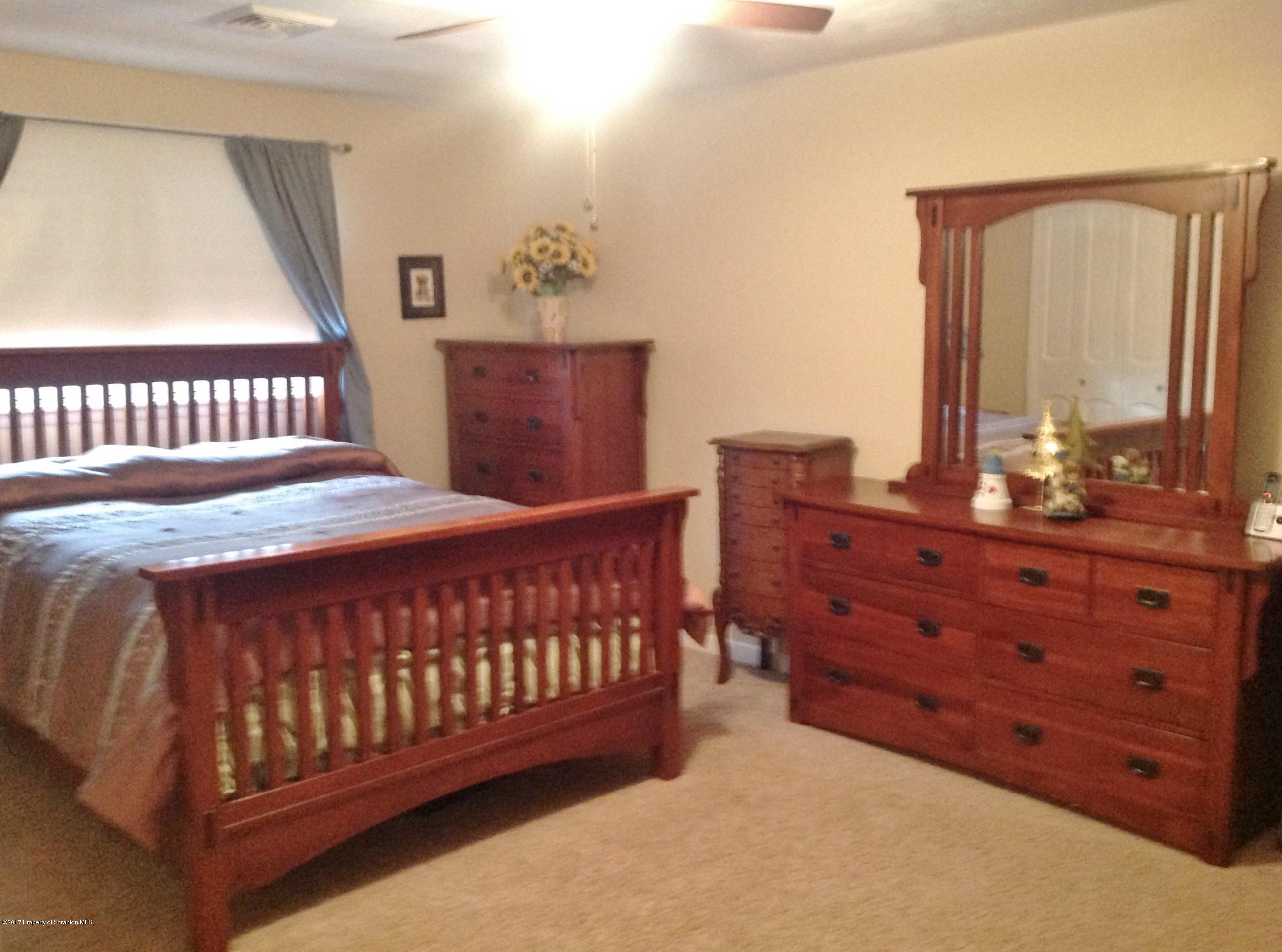 2610 Motichka Road Moscow, PA 18444 - Photo 7 of 14 a bedroom with a bed and window