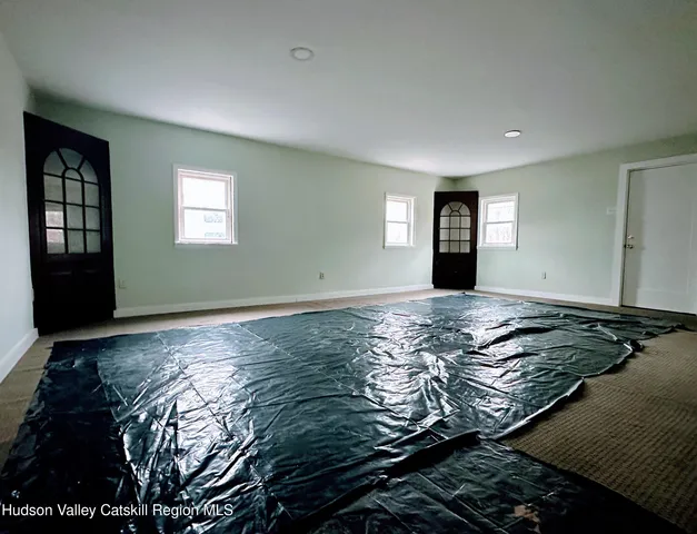 a bedroom with bed and window