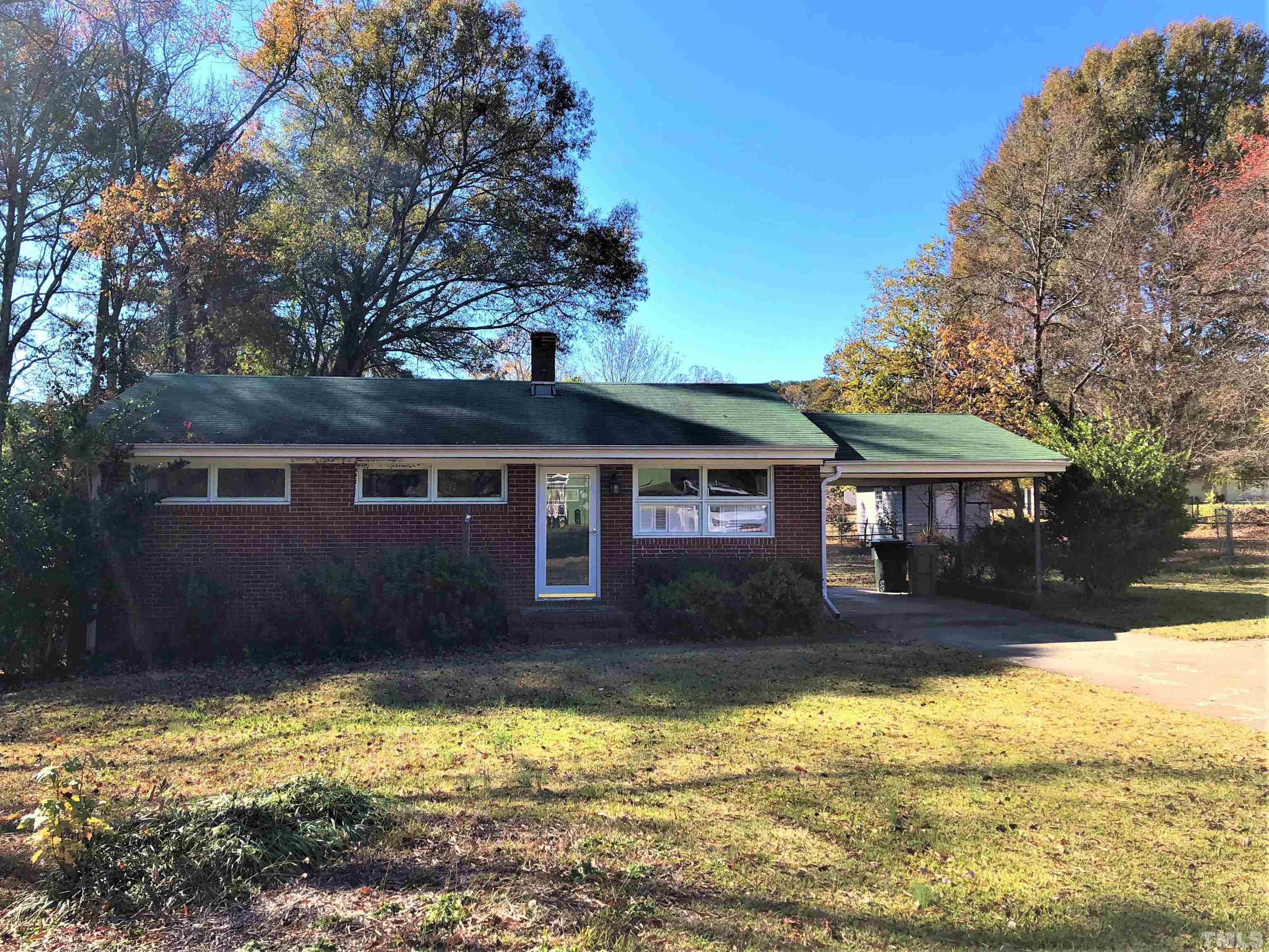 1402 Southerlund Road Garner, NC 27529 - Photo 1 of 18 a front view of a house with a yard