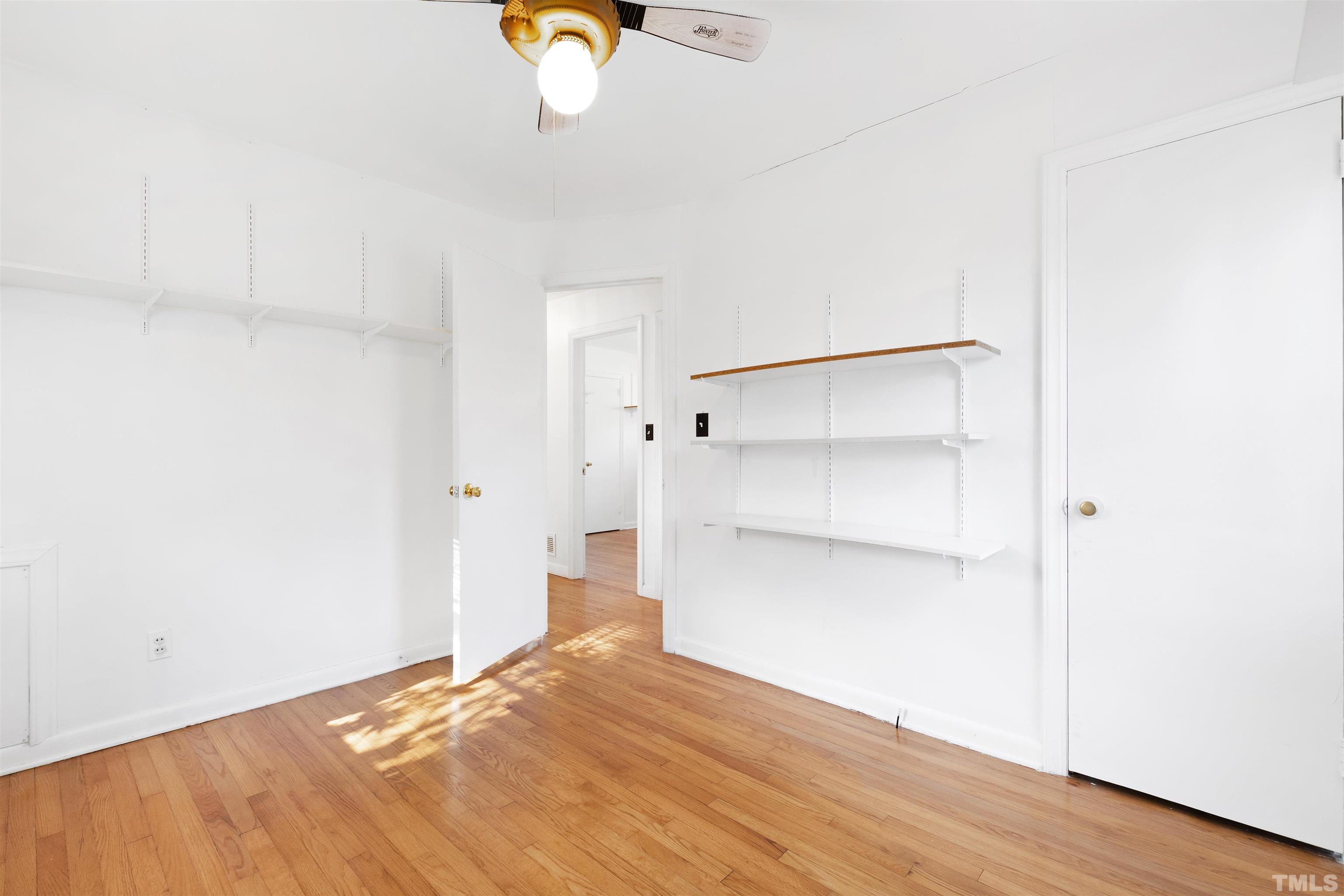1402 Southerlund Road Garner, NC 27529 - Photo 11 of 18 a view of empty room with wooden floor