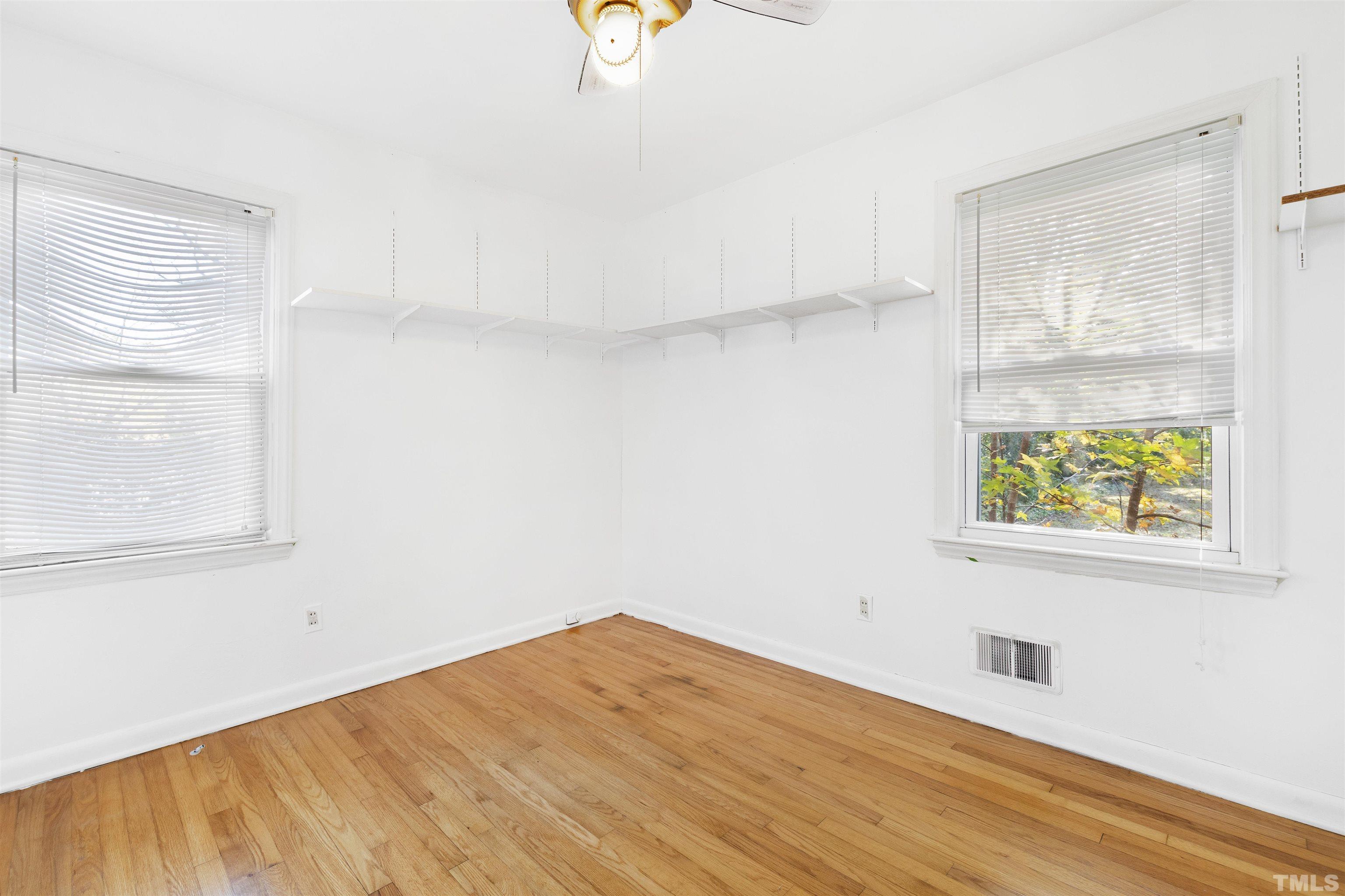 1402 Southerlund Road Garner, NC 27529 - Photo 18 of 18 an empty room with windows