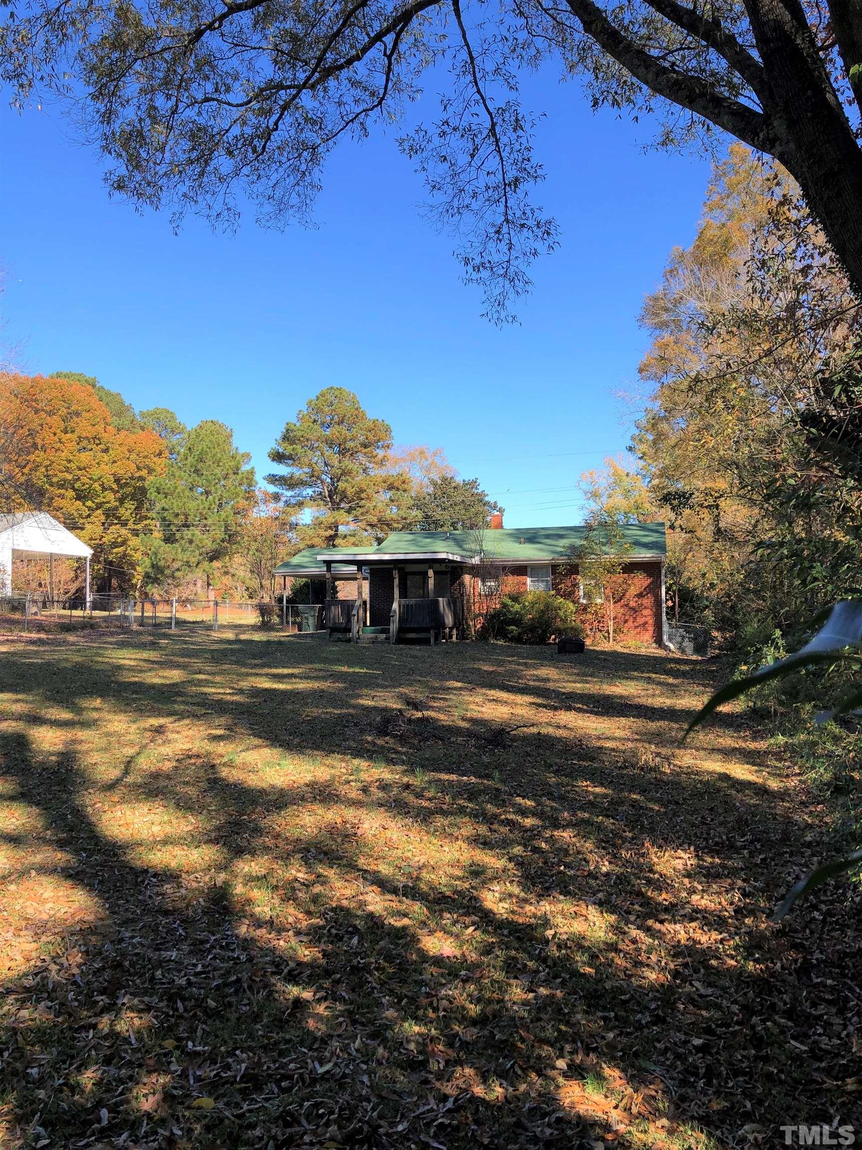 1402 Southerlund Road Garner, NC 27529 - Photo 7 of 18 a view of a house with a yard