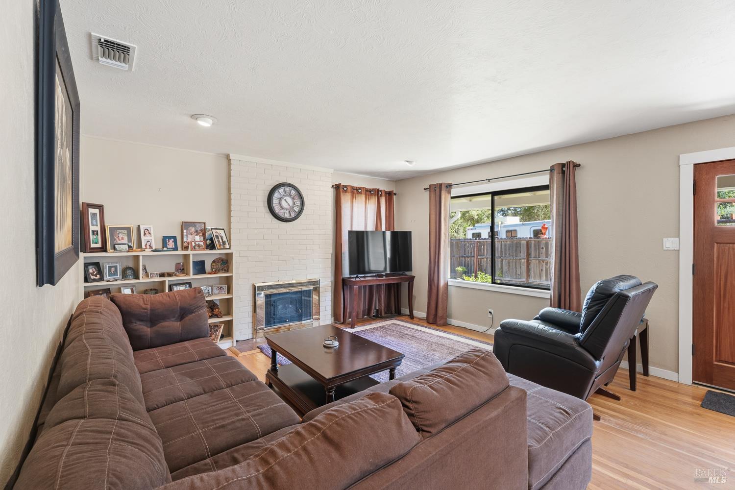 2260 Old River Road Ukiah, CA 95482 - Photo 13 of 29 a living room with furniture or couch and a fireplace