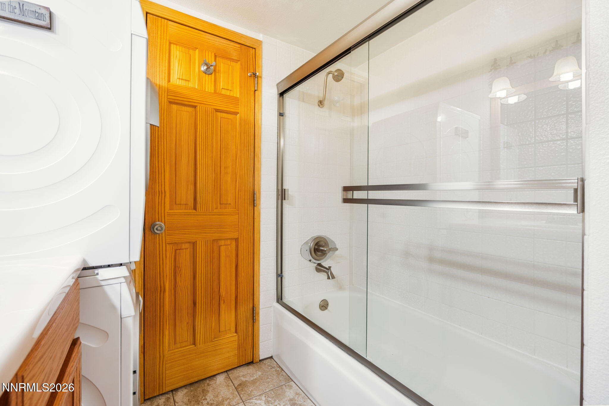 759 Boulder Court, Unit F Stateline, NV 89449 - Photo 21 of 36 a bathroom with a shower and a glass door