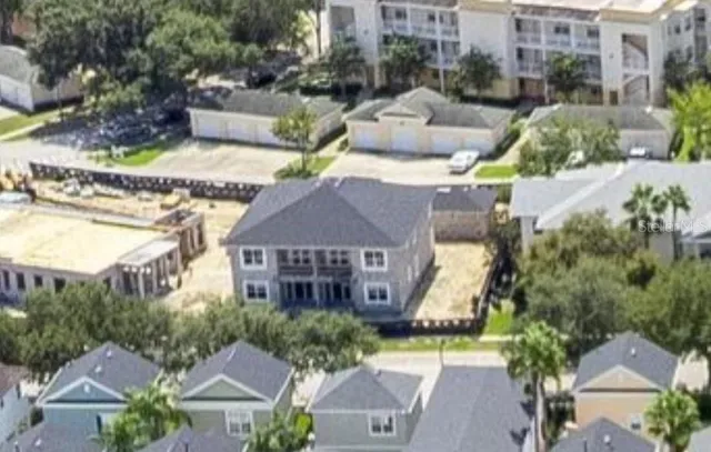 an aerial view of a house with a garden and plants