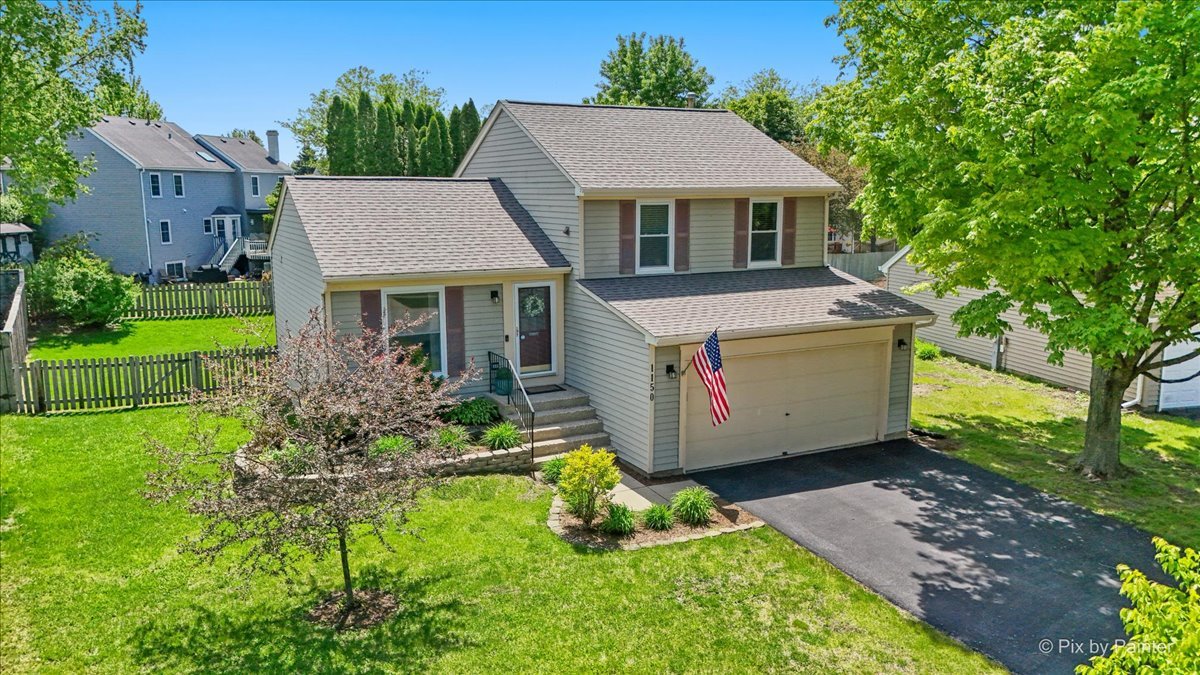 1150 Appleton Lane Geneva, IL 60134 - Photo 1 of 43 a house view with a garden space