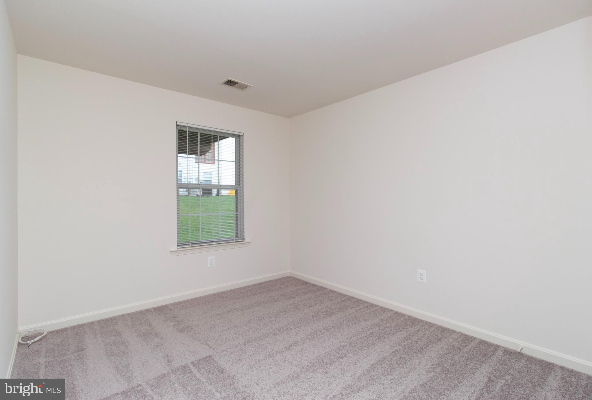 4145 Apple Orchard Court, Unit 1 Suitland, MD 20746 - Photo 11 of 16 an empty room with a window