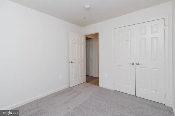 a bathroom with a toilet and a bath tub