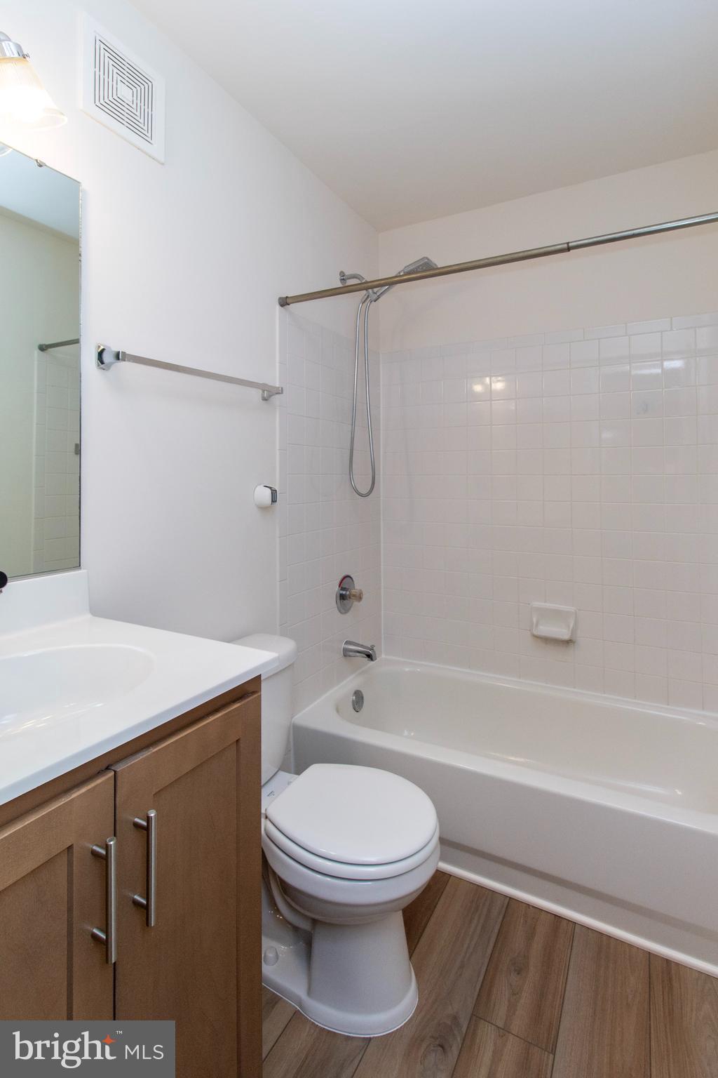 4145 Apple Orchard Court, Unit 1 Suitland, MD 20746 - Photo 10 of 16 a bathroom with a sink a toilet and a bathtub