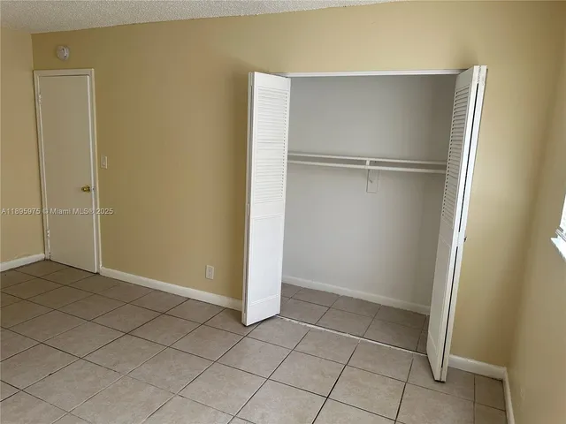an empty room with white door