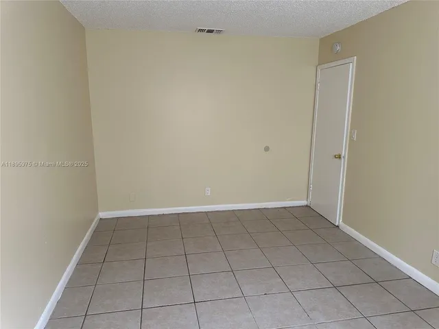 a view of a small space with wooden floor