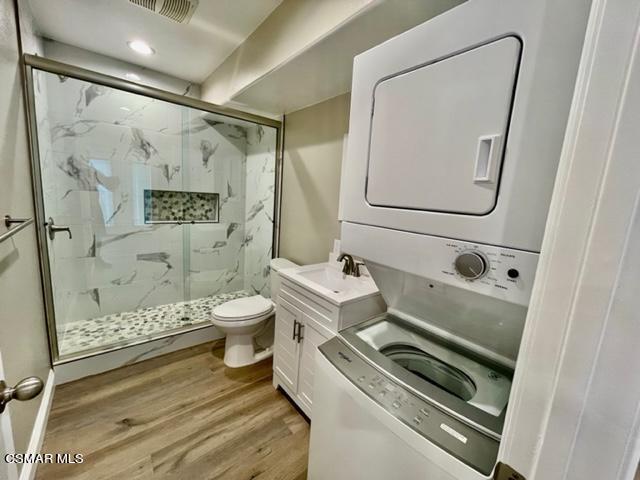 1243 Able Circle Simi Valley, CA 93065 - Photo 5 of 10 a bathroom with a sink a toilet and shower