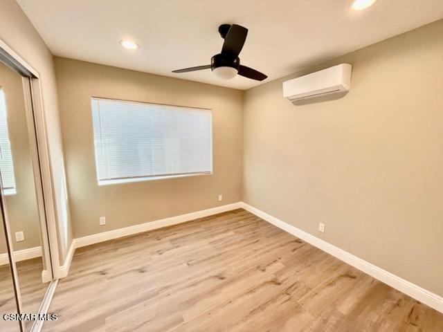 1243 Able Circle Simi Valley, CA 93065 - Photo 6 of 10 a view of an empty room with wooden floor and a window