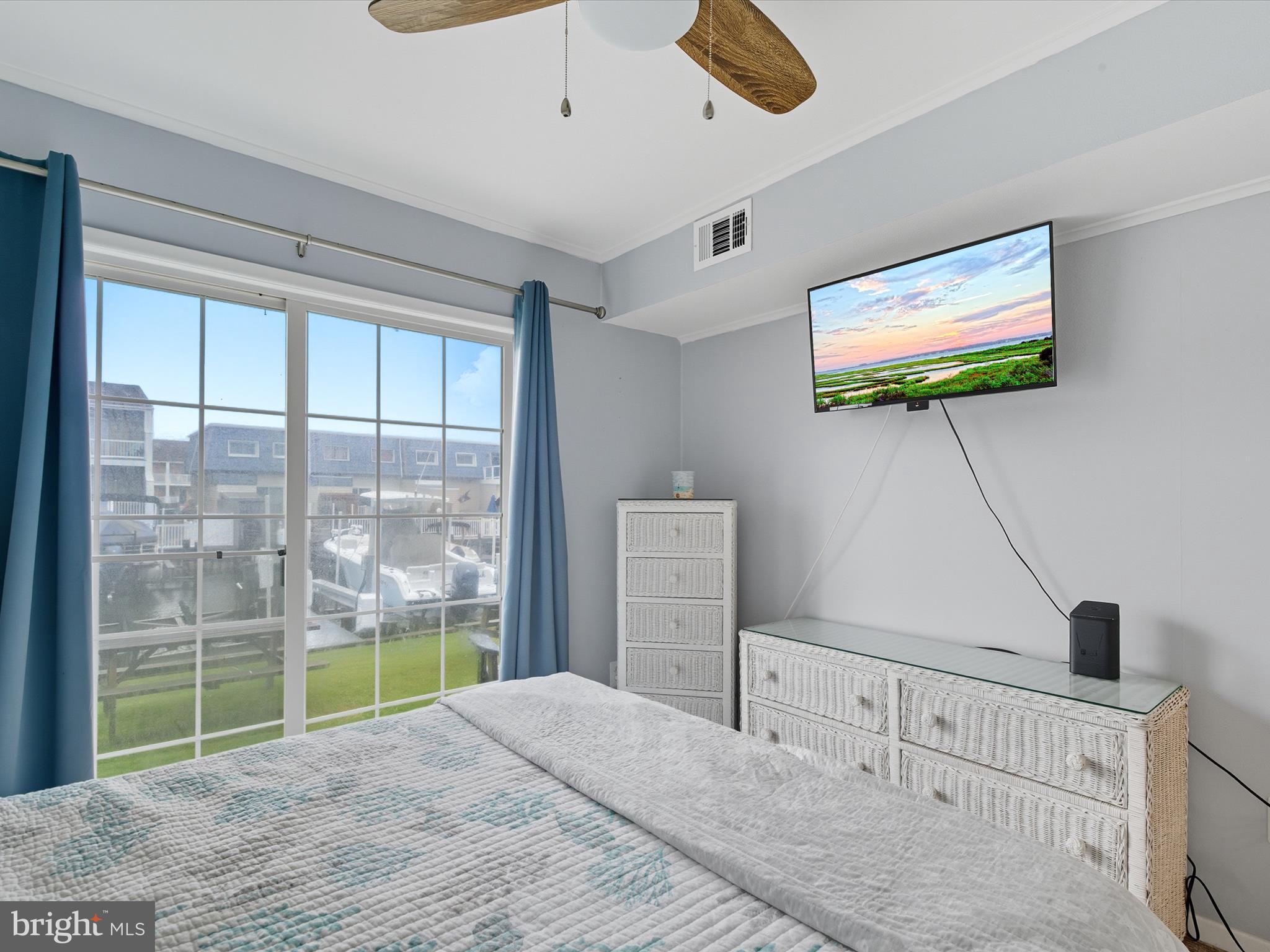 710 Bradley Road, Unit A2 Ocean City, MD 21842 - Photo 14 of 40 a bedroom with furniture and a flat screen tv