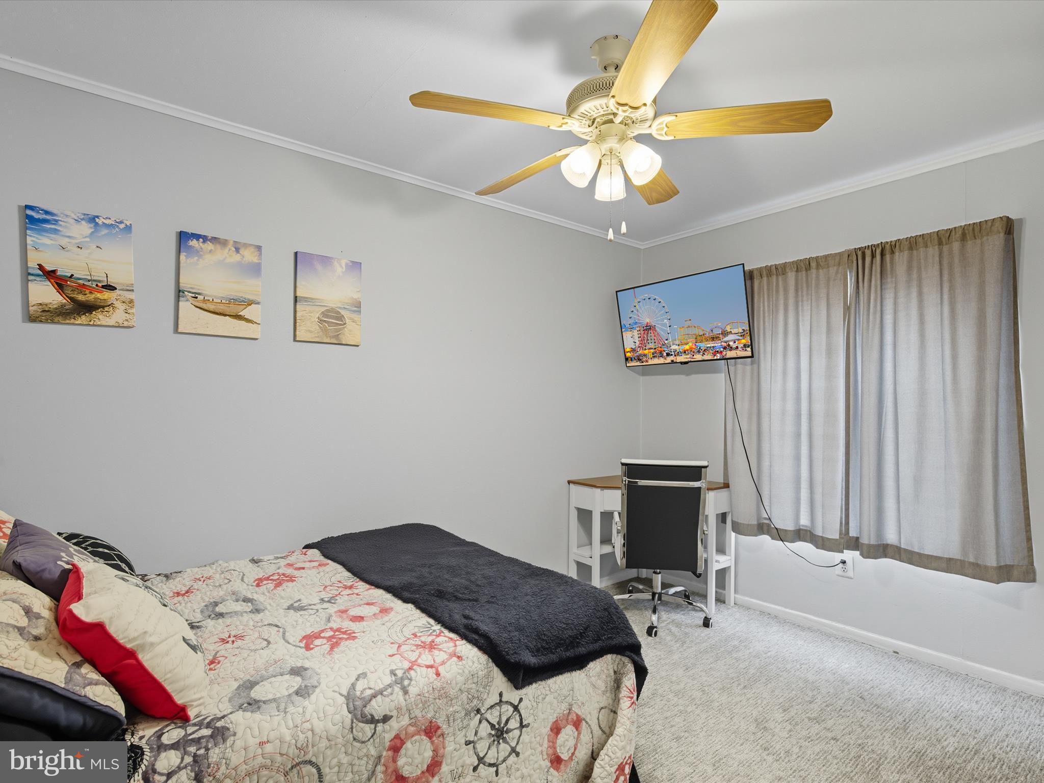 710 Bradley Road, Unit A2 Ocean City, MD 21842 - Photo 18 of 40 a bedroom that has a bed and a chandelier