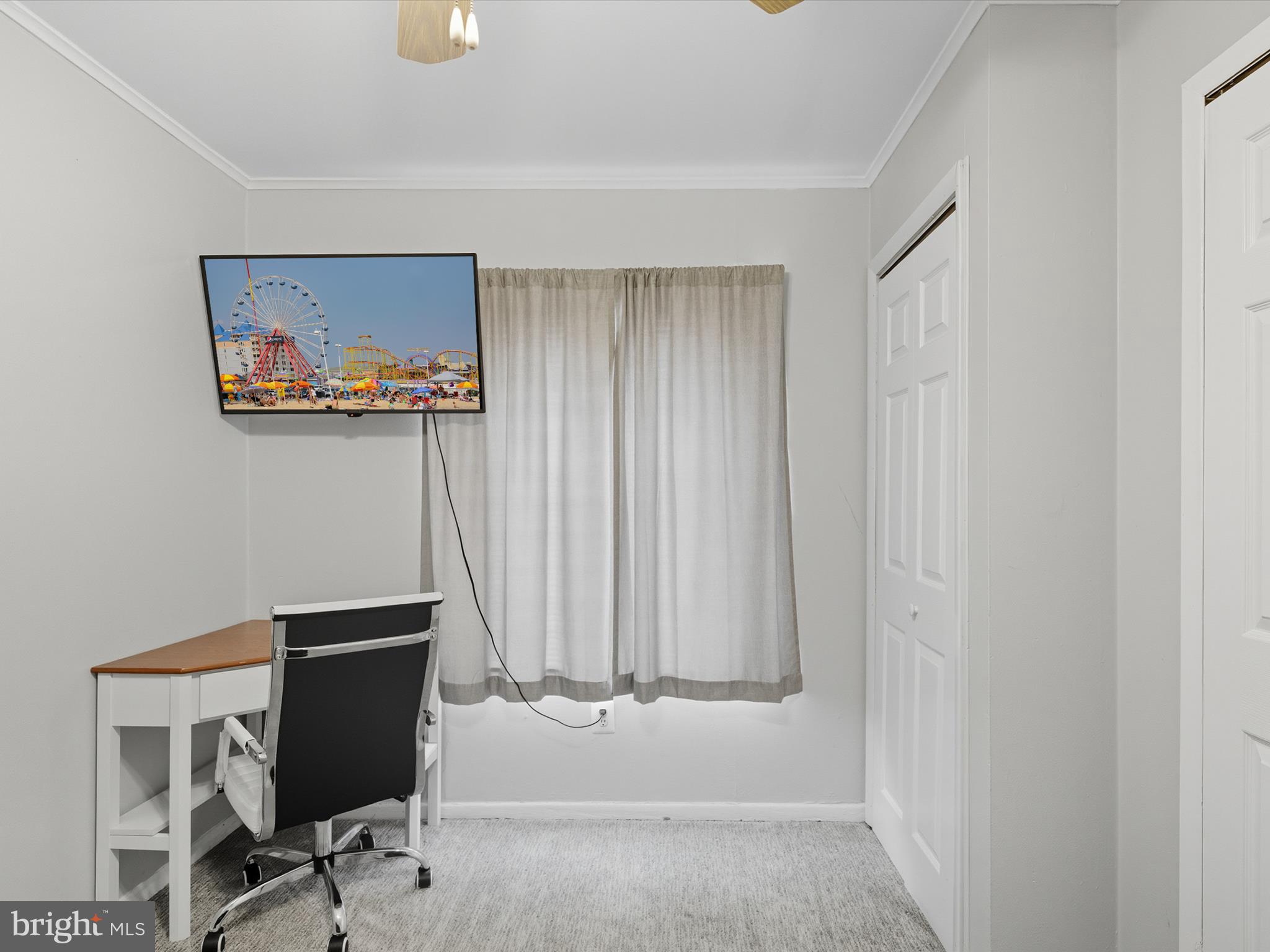 710 Bradley Road, Unit A2 Ocean City, MD 21842 - Photo 20 of 40 a view of a hallway with workspace and a window