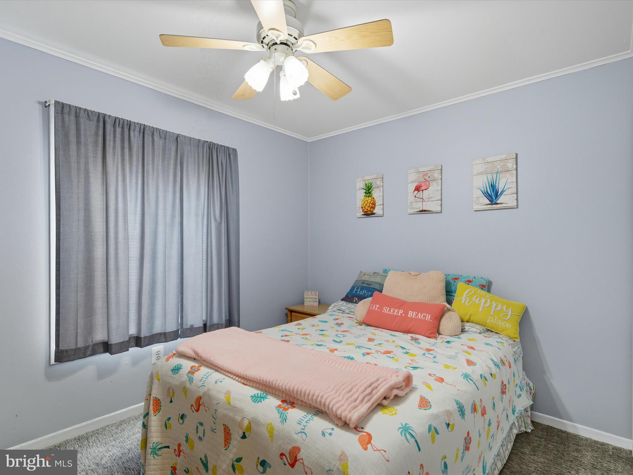 710 Bradley Road, Unit A2 Ocean City, MD 21842 - Photo 24 of 40 a bedroom with a bed and a chandelier