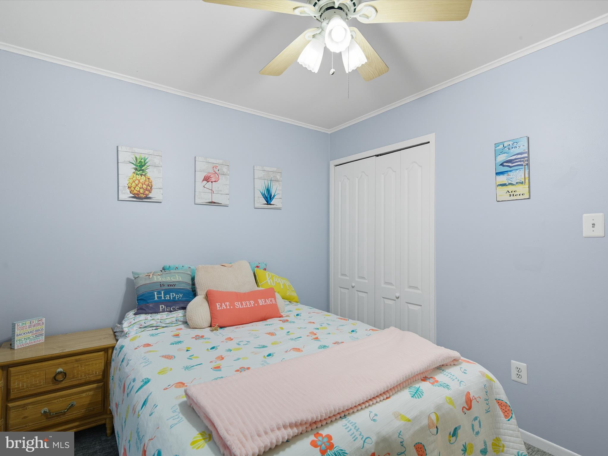 710 Bradley Road, Unit A2 Ocean City, MD 21842 - Photo 25 of 40 a bedroom with a bed and a chandelier