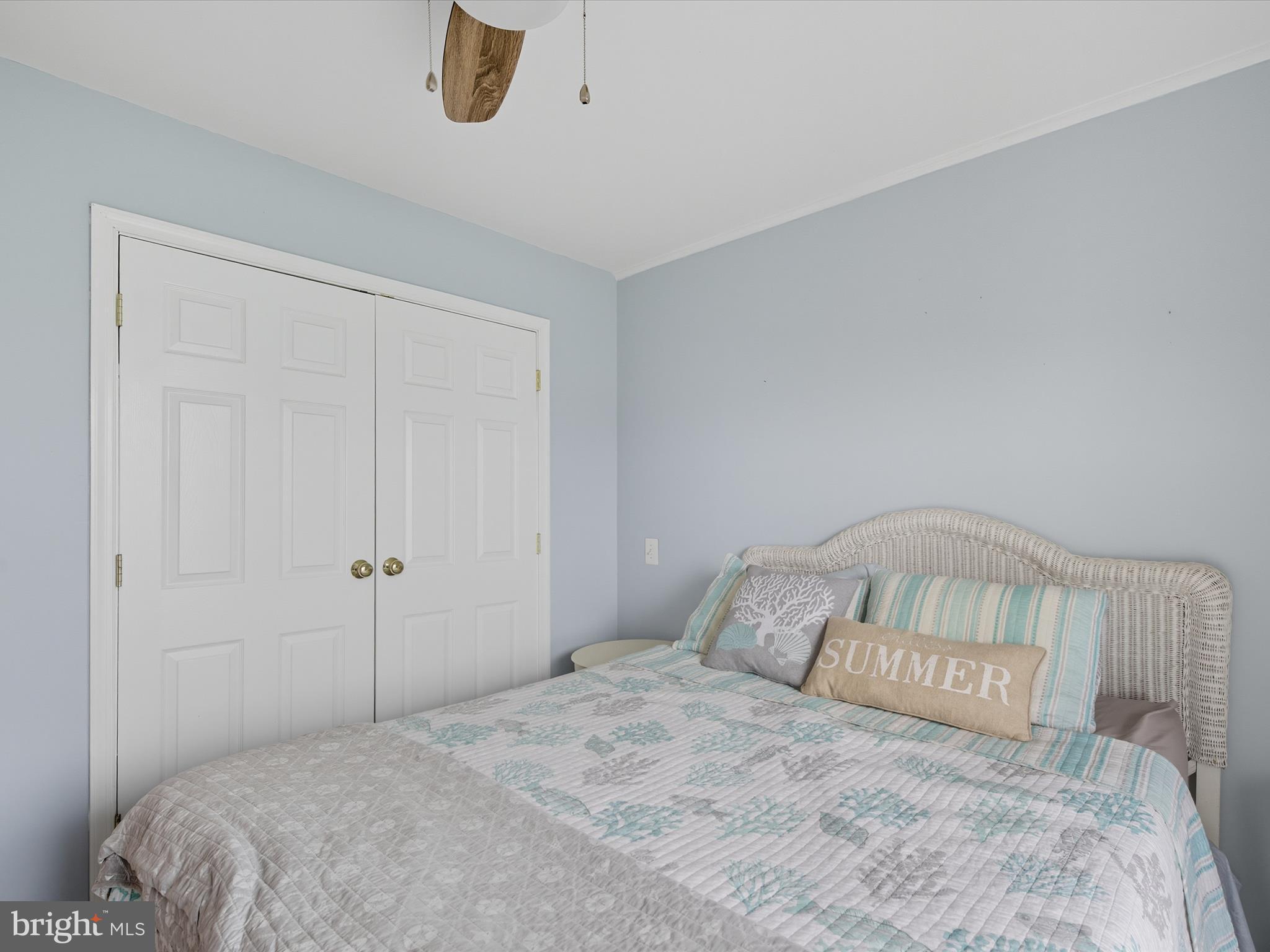 710 Bradley Road, Unit A2 Ocean City, MD 21842 - Photo 27 of 40 a bedroom with a bed and a window