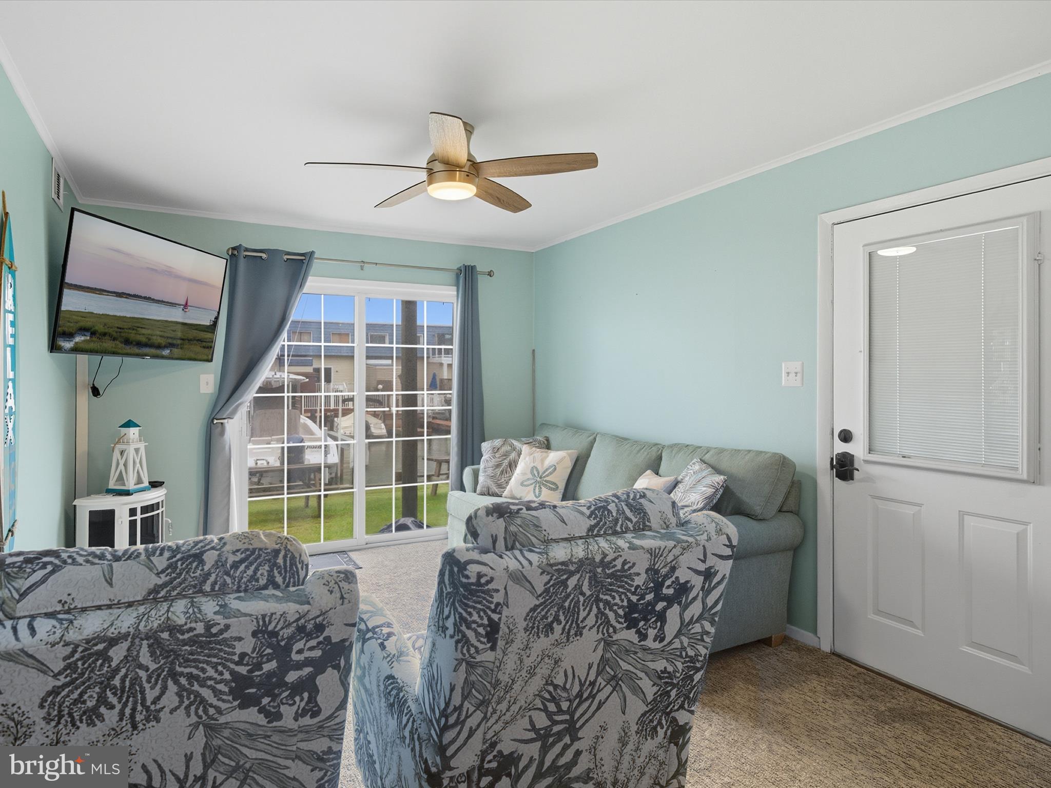 710 Bradley Road, Unit A2 Ocean City, MD 21842 - Photo 3 of 40 a bed sitting in a bedroom next to a window