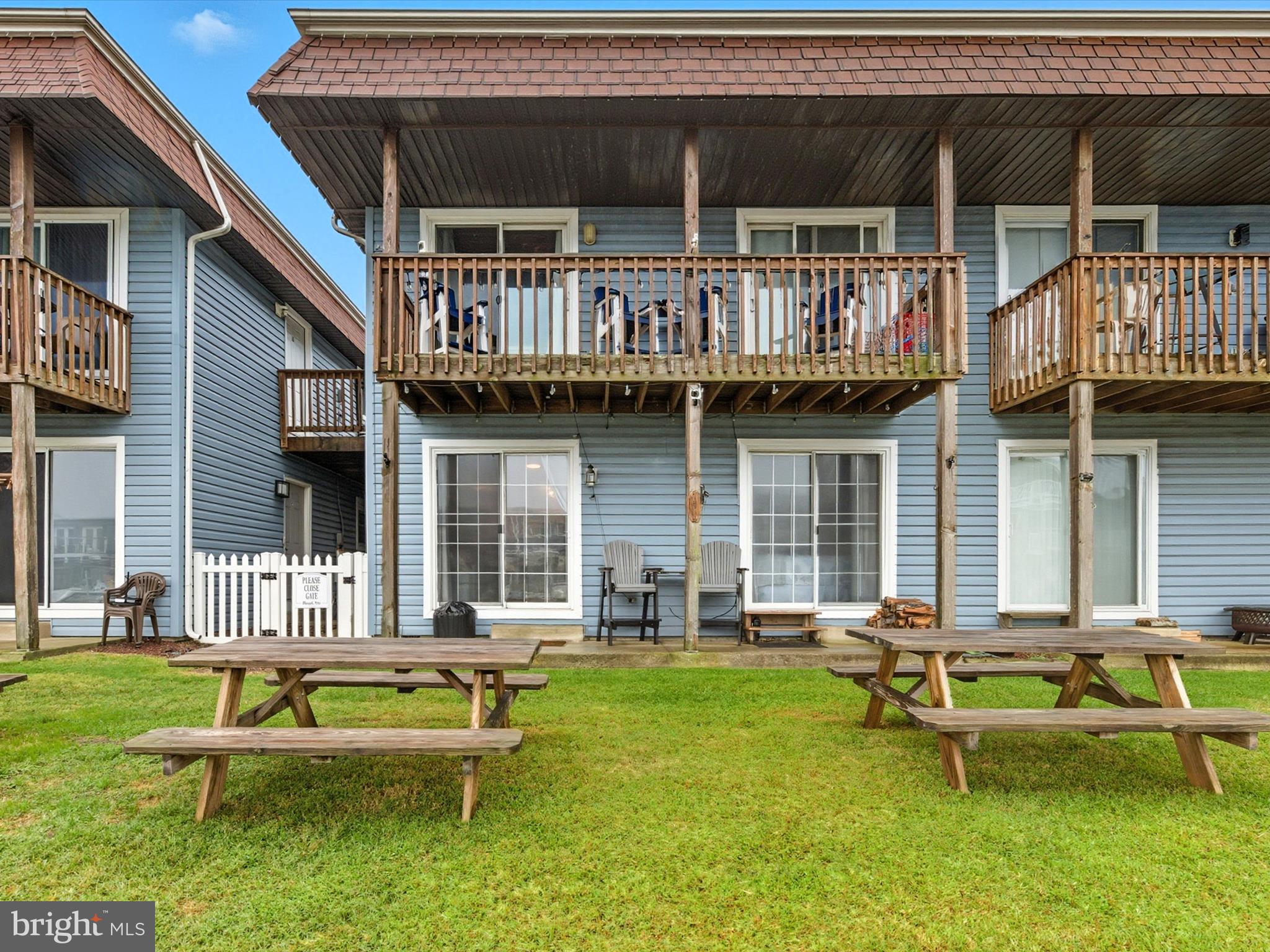 710 Bradley Road, Unit A2 Ocean City, MD 21842 - Photo 36 of 40 a view of a house with a lounge chair and swimming pool