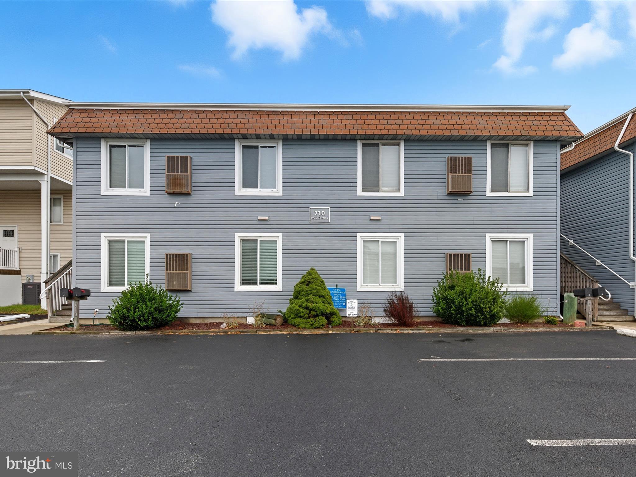 710 Bradley Road, Unit A2 Ocean City, MD 21842 - Photo 38 of 40 a front view of a house with a garden