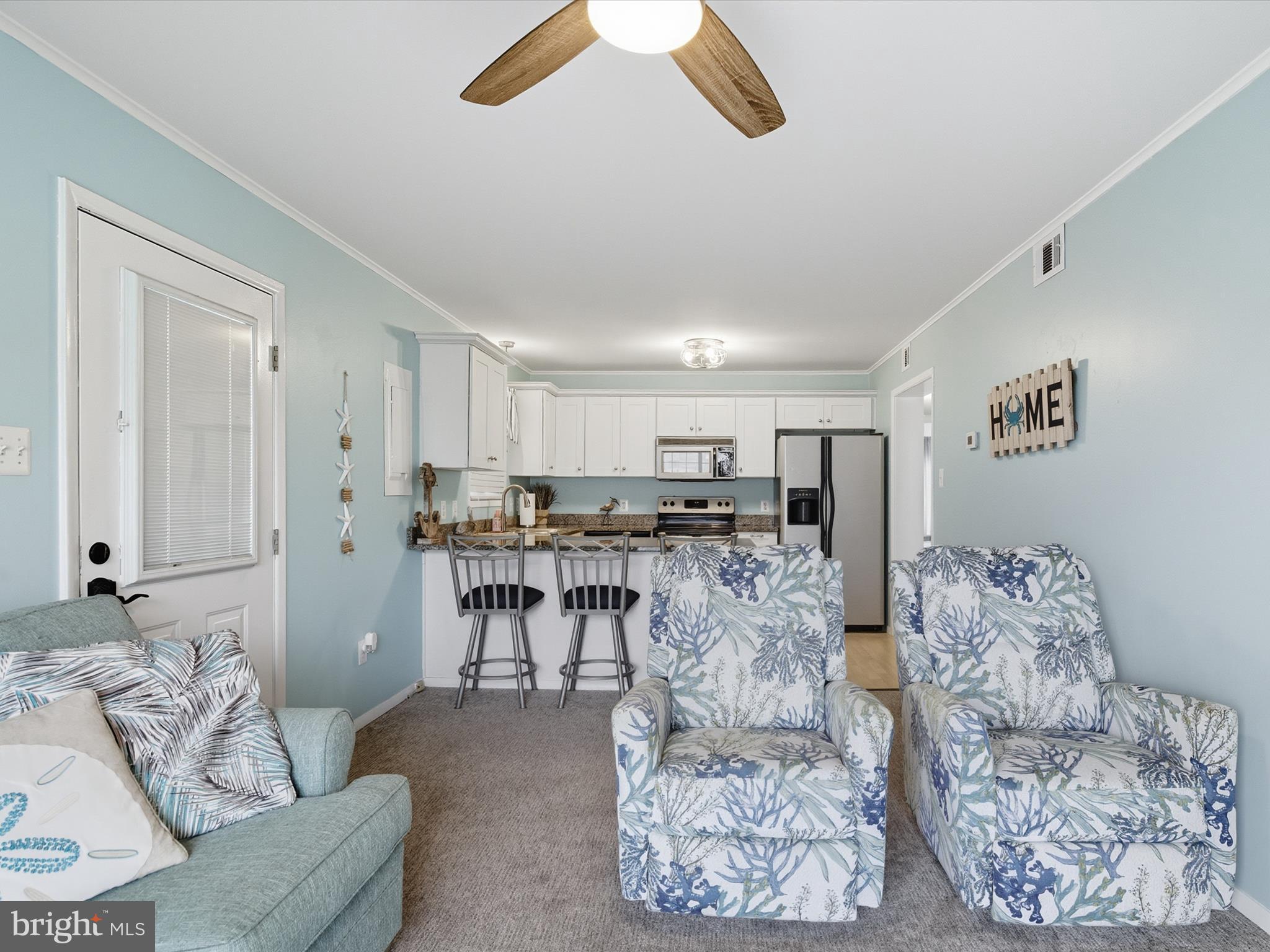 710 Bradley Road, Unit A2 Ocean City, MD 21842 - Photo 8 of 40 a living room with furniture and white walls