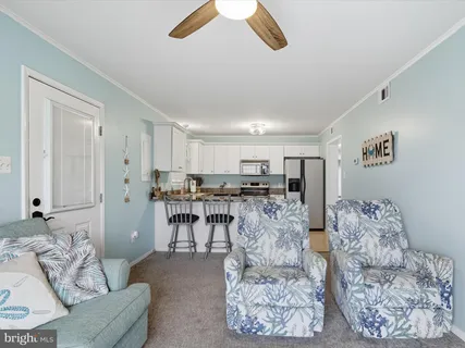 a living room with furniture and white walls