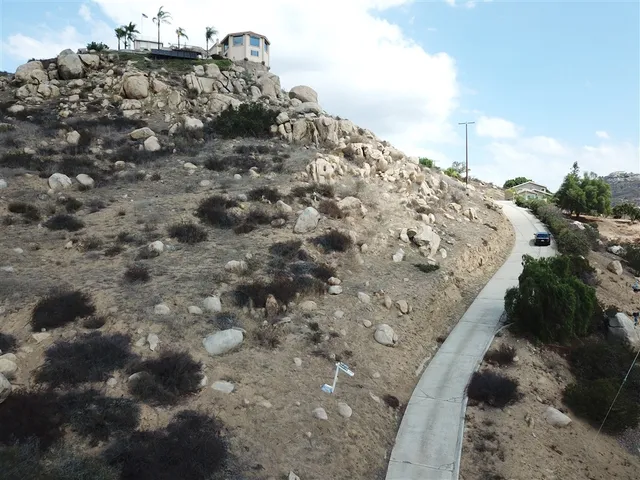 an aerial view of residential houses with city view
