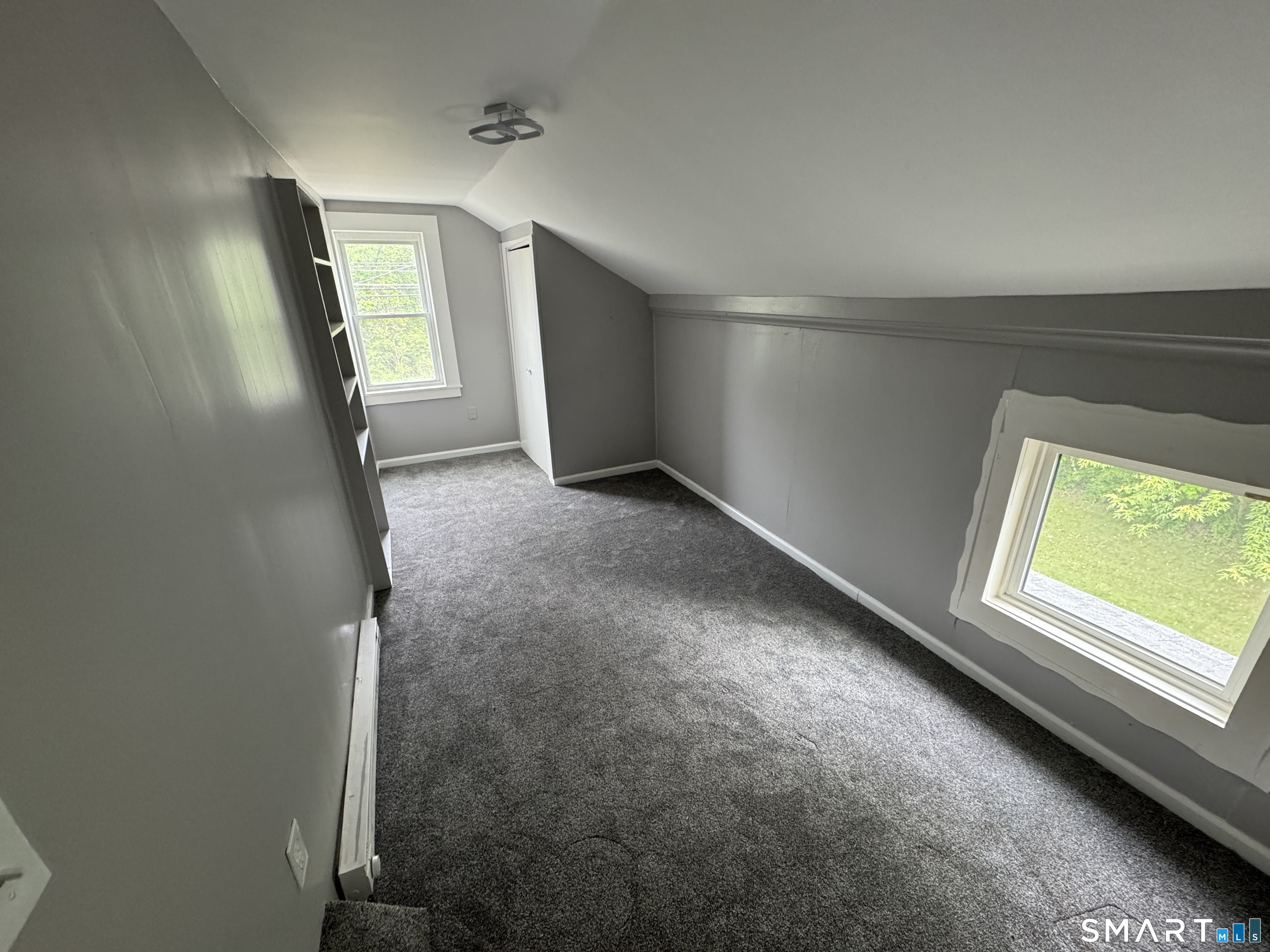 10 Center Street Windsor Locks, CT 06096 - Photo 10 of 25 an empty room with windows