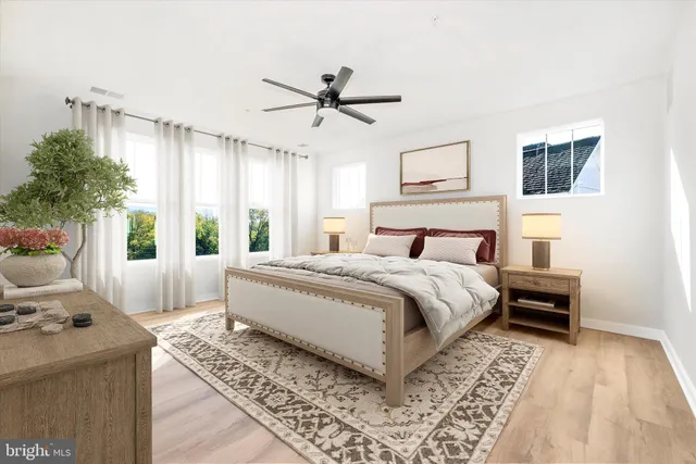 a bedroom with a large bed and a window