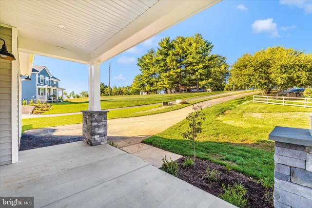 a view of a swimming pool with an outdoor space and seating area