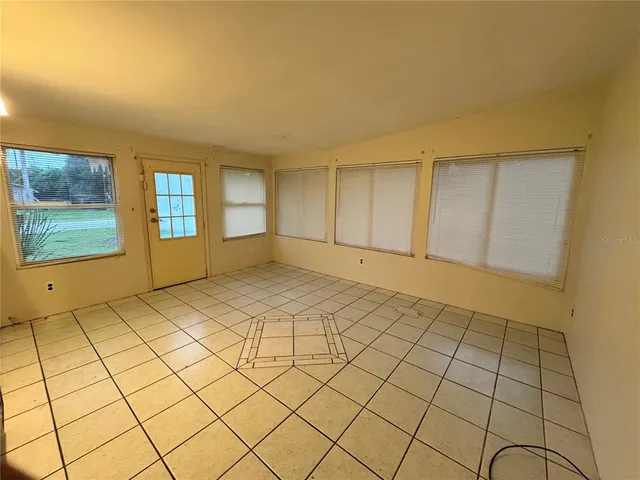 a kitchen with a sink a stove top oven and cabinets