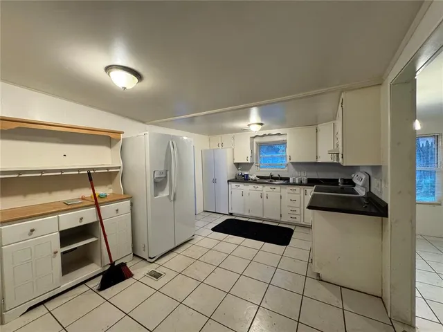 a view of empty room with fireplace