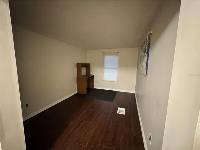 a bathroom with a sink vanity and mirror