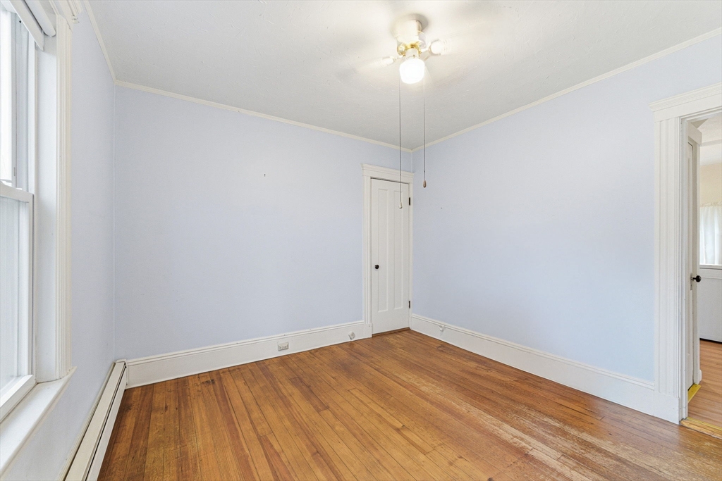 5 Springdale Avenue Saugus, MA 01906 - Photo 12 of 25 an empty room with a hardwood and ceiling fan