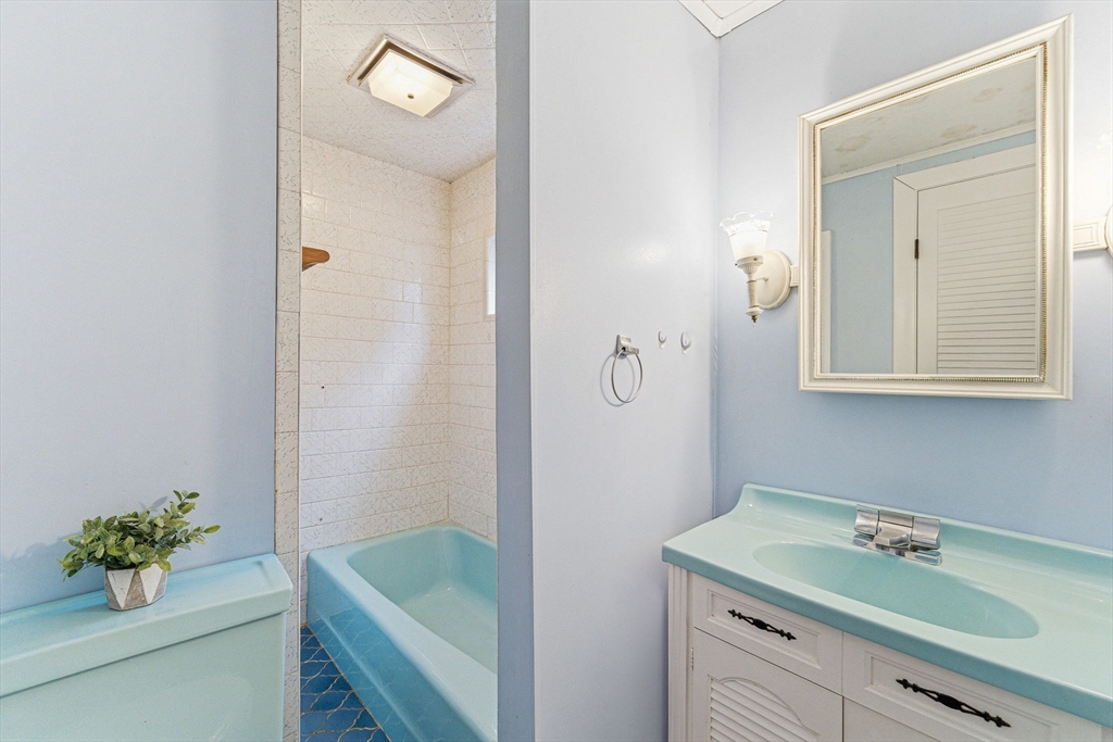 5 Springdale Avenue Saugus, MA 01906 - Photo 15 of 25 a bathroom with a tub sink and mirror