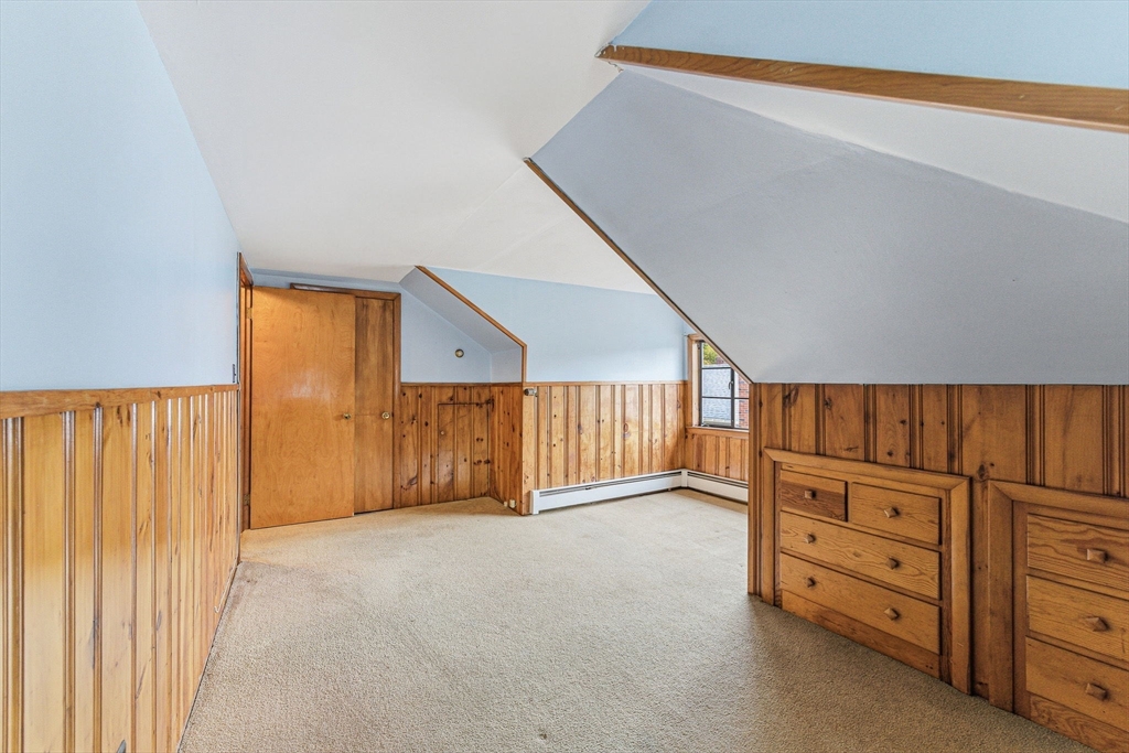 5 Springdale Avenue Saugus, MA 01906 - Photo 19 of 25 a view of an empty room with cabinet and stairs