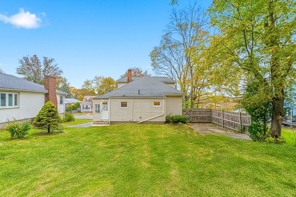 5 Springdale Avenue Saugus, MA 01906 - Photo 6 of 25 a view of a house with a big yard and large tree