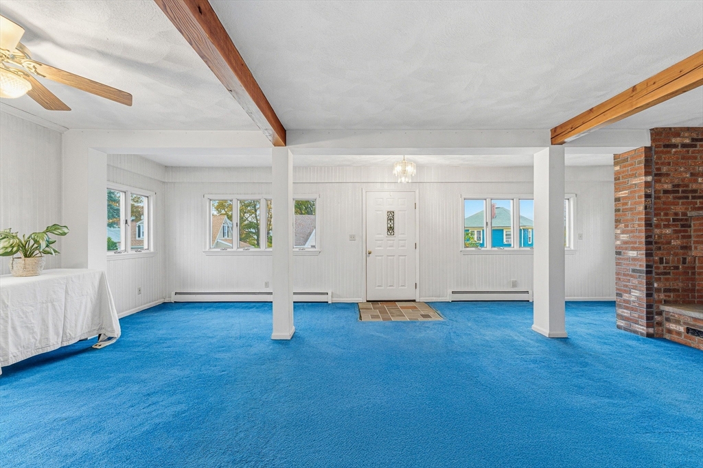5 Springdale Avenue Saugus, MA 01906 - Photo 8 of 25 an empty room with wooden floor and windows
