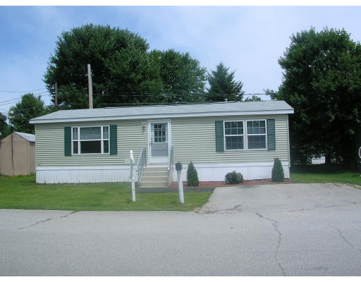 4 Boston Post Road Amherst, NH 03031 - Photo 1 of 1 a front view of a house with a yard and garage