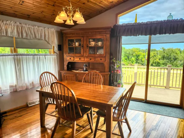 a dinning table and chairs in the patio