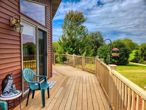 a view of a balcony with wooden floor