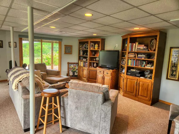 a bedroom with furniture and a book shelf