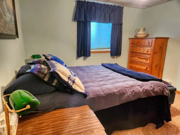 a spacious bathroom with a double vanity sink toilet and shower