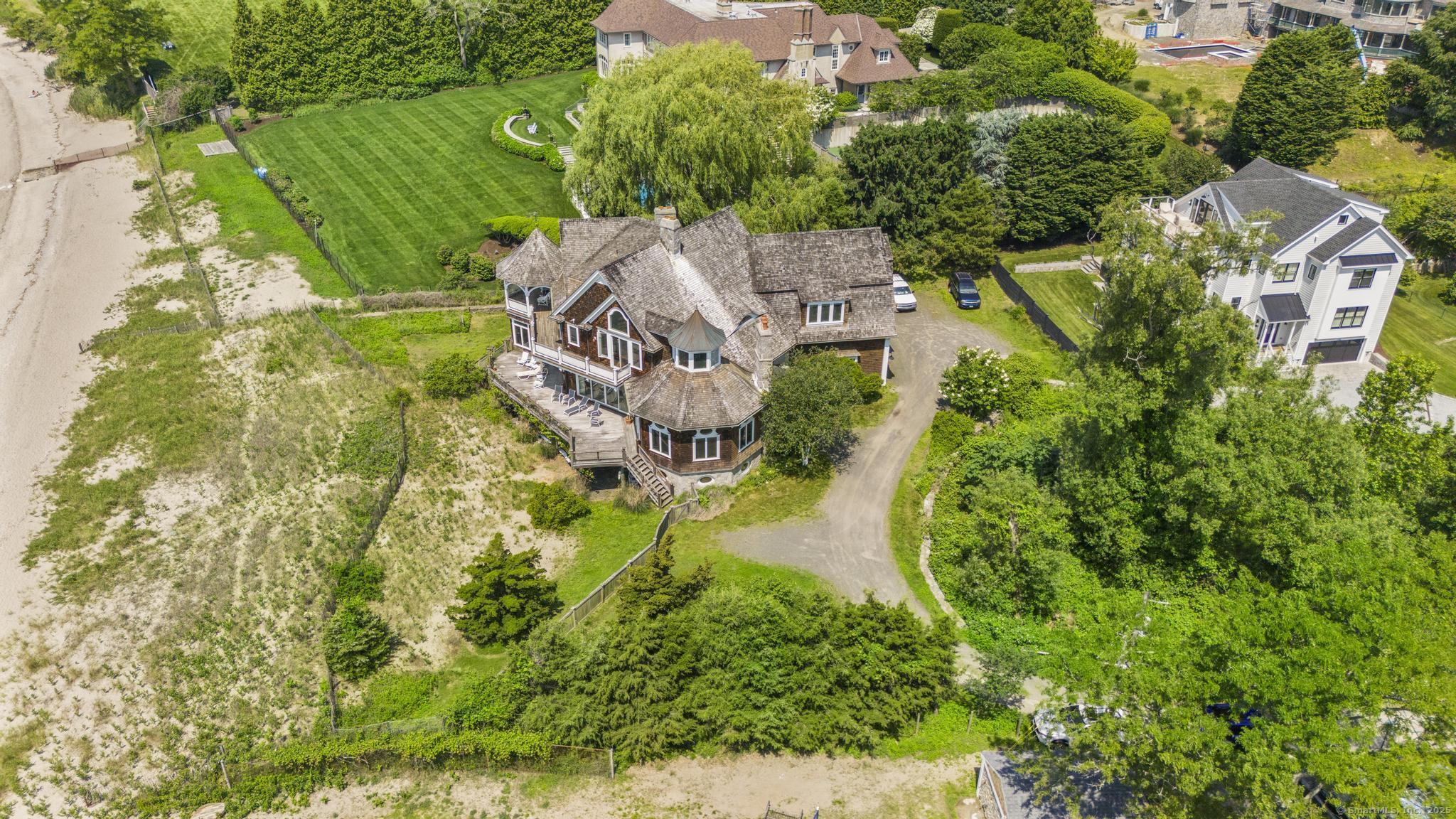 1410 South Pine Creek Road Fairfield, CT 06824 - Photo 12 of 40 an aerial view of residential house with outdoor space and trees all around