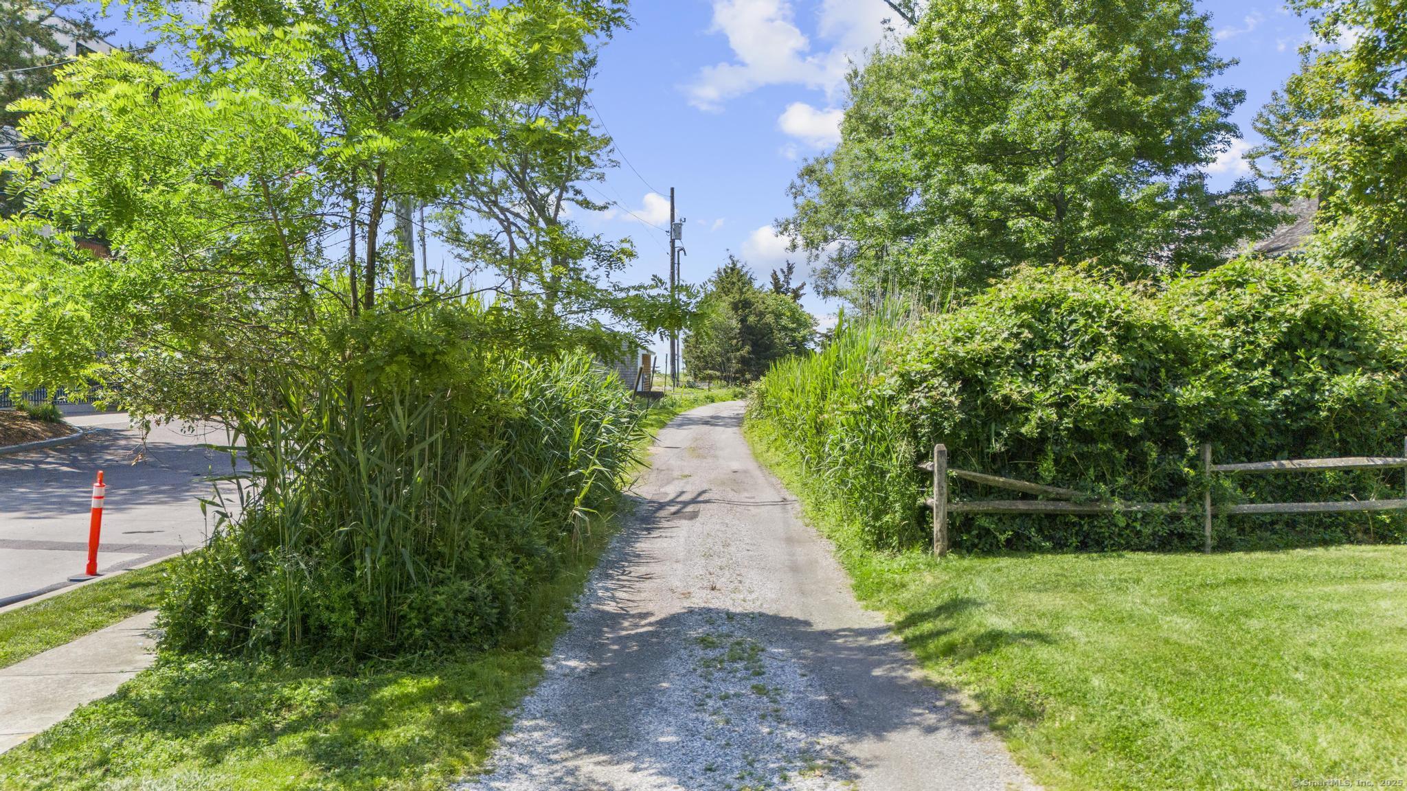 1410 South Pine Creek Road Fairfield, CT 06824 - Photo 13 of 40 a view of a pathway of a yard
