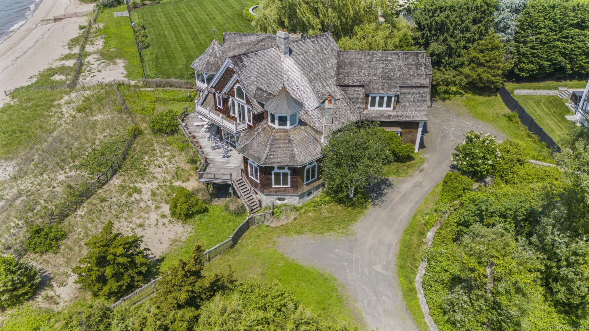1410 South Pine Creek Road Fairfield, CT 06824 - Photo 19 of 40 an aerial view of a house with a garden