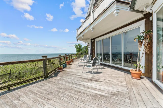 a living room with lots of furniture and a large window