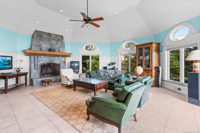 a kitchen with stainless steel appliances granite countertop a stove a sink dishwasher and a refrigerator